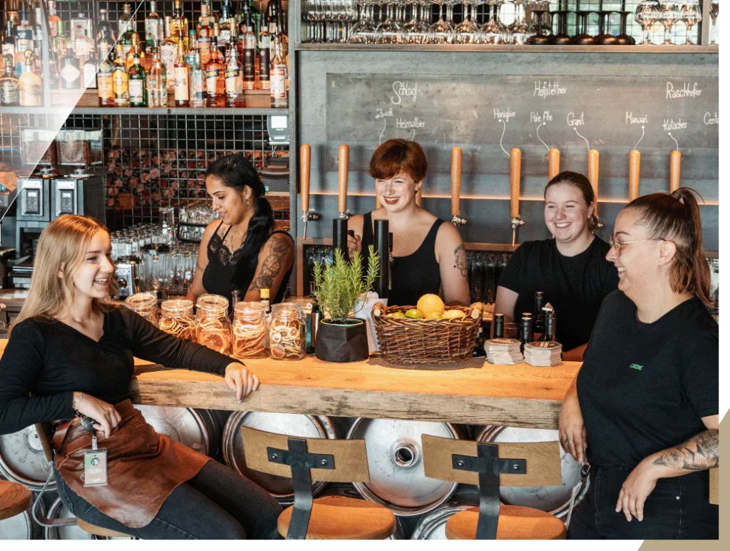 Employees at the bar of the Glorious Bastards